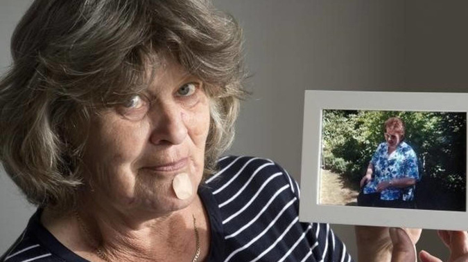 palmerston-woman-donna-te-waihia-holds-a-photograph-of-her-late-mother-patricia-dickson-gerard-obrien.jpg