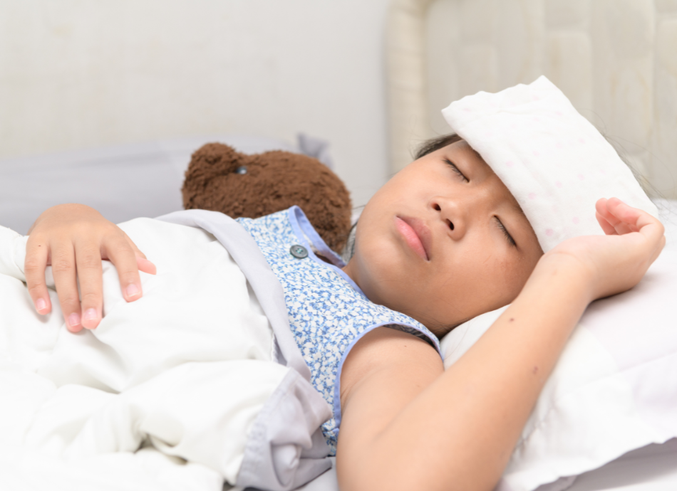 Child-with-fever-and-teddy-in-bed-canva-950x690.png